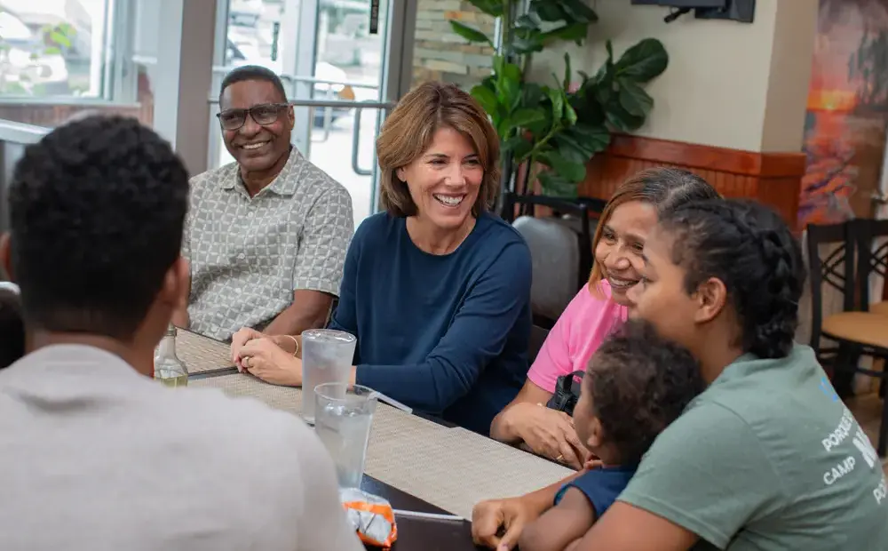 A candid photo of Helena speaking to constituents